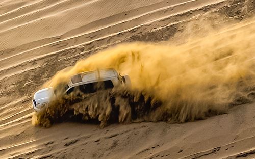 SUV on sand dune